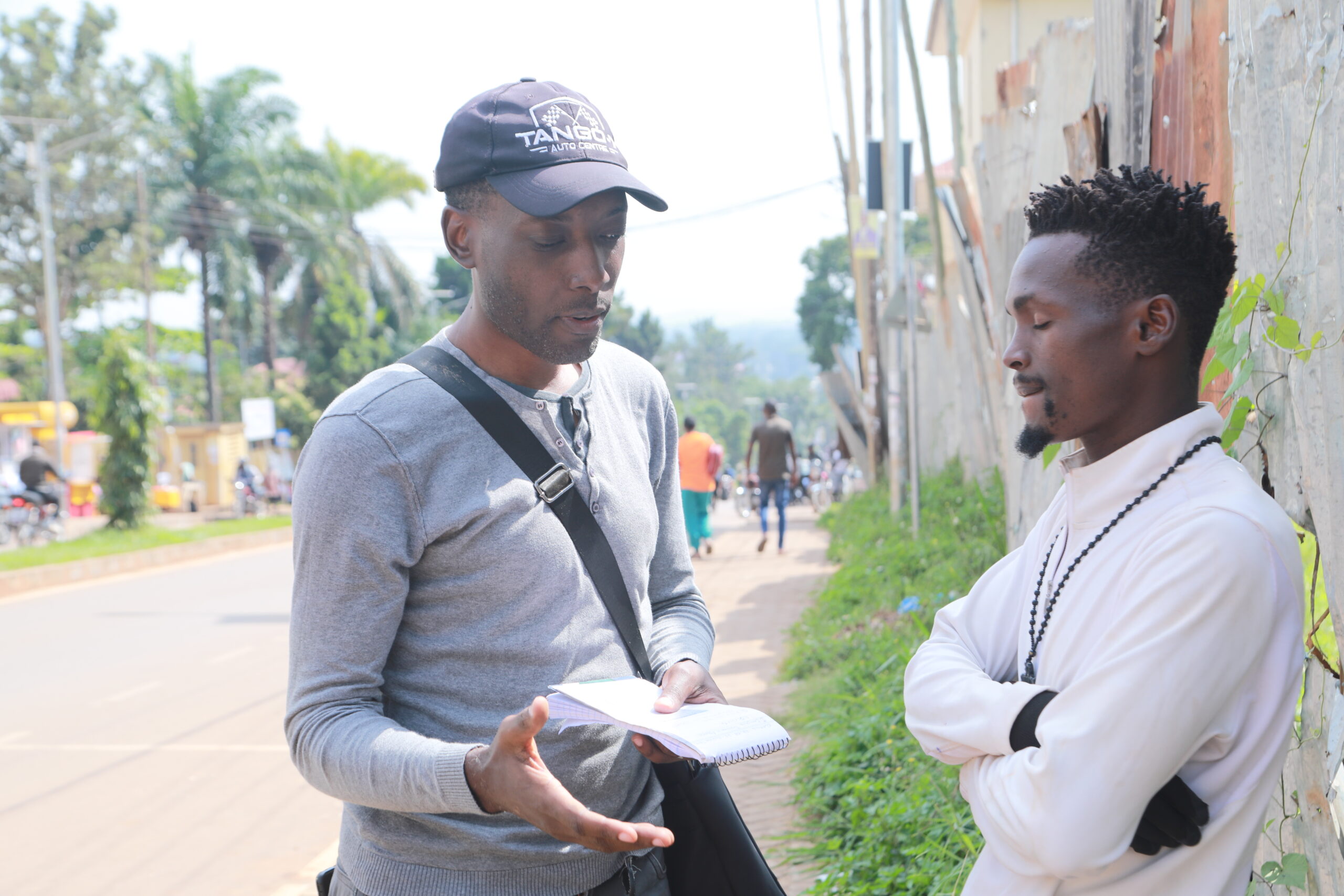 a member of Entebbe Baptist Church sharing the gospel with a resident of Entebbe