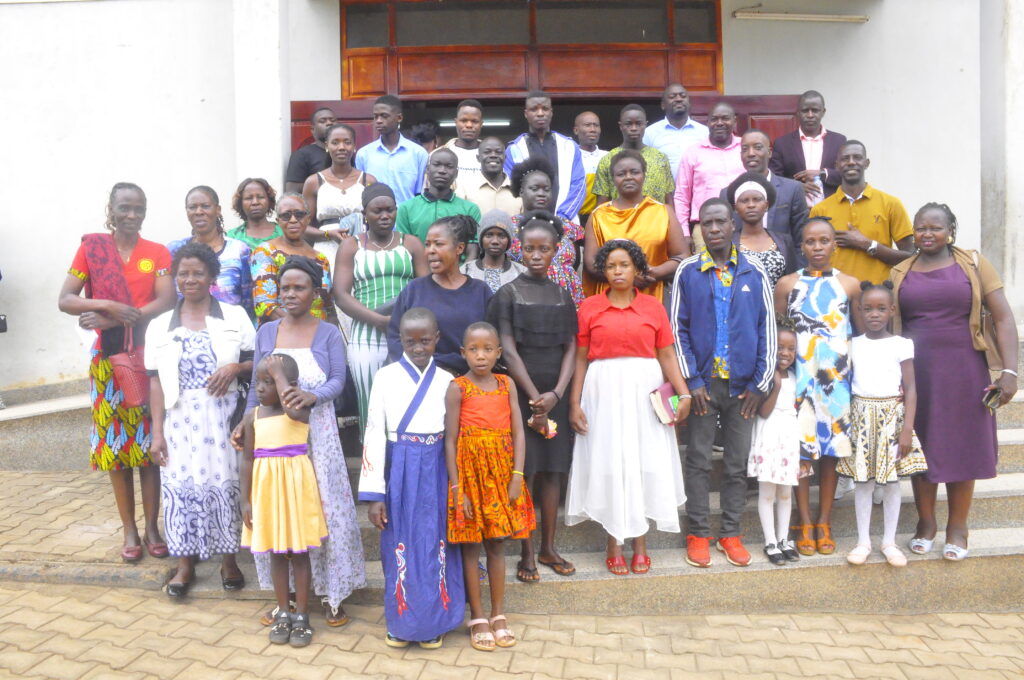 church congregants pose for a photo after a church service