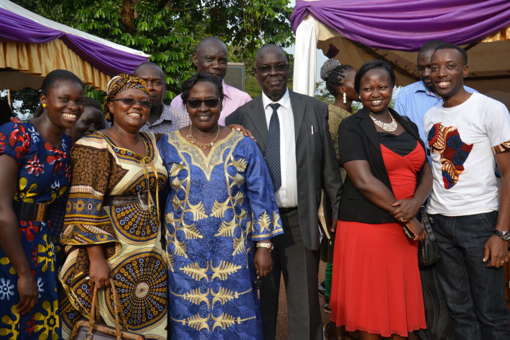 Members of Entebbe Baptist Church pose with Pastor John Ekudu-Adoku and his wife, Grace Ekudu at church 