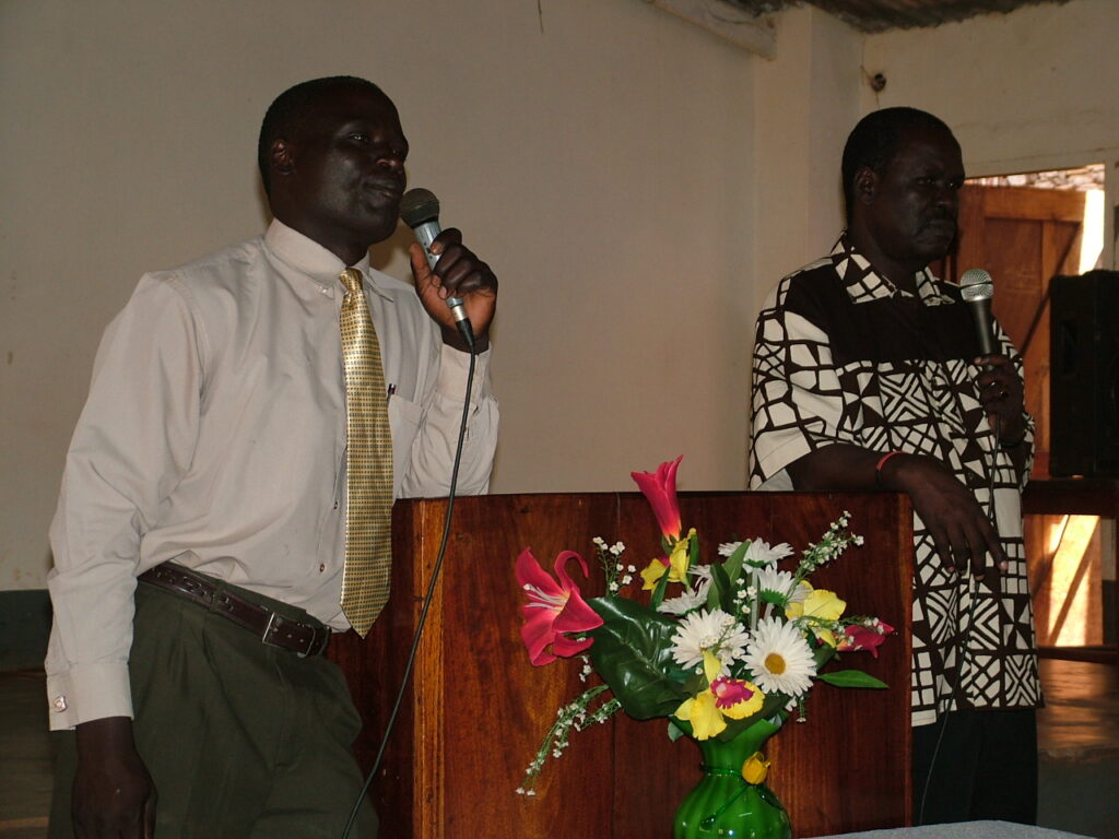 Image of Pastor Ekudu preaching a sermon at Entebbe Baptist Church