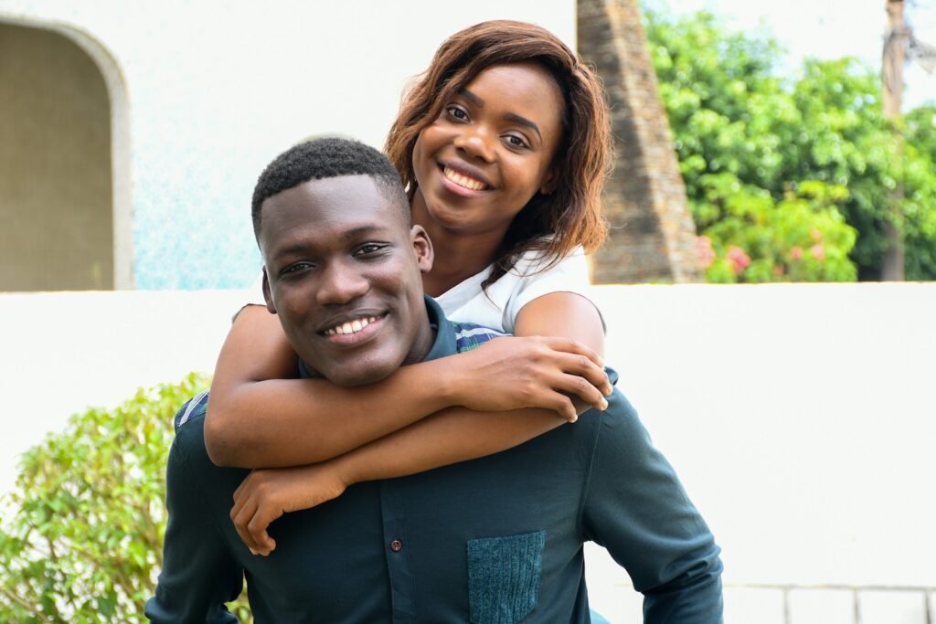 a woman hugging a man